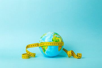 Big data, research, study, distances, measurements and size concept. Earth globe and measuring tape...