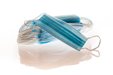 Blue medical masks, as protection against viruses, isolated on white background, concept covid19.