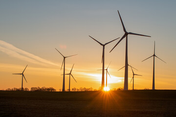 wind turbines in the rising sun