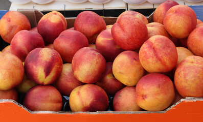 Fresh raw peaches on market