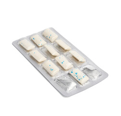 rectangular pieces of gum in a blister pack on a white background