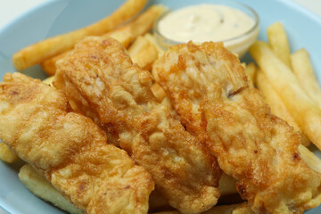 Plate with fried fish and chip, close up