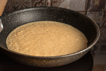 Frying cooking pancake on a frying pan. Home cooking