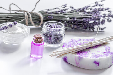 organic cosmetic with lavender flowers and oil on white background
