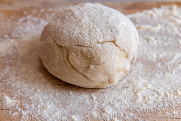 Fototapeta na wymiar knead dough on a wooden board