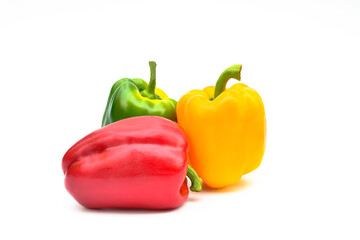 Fresh vegetables Three sweet pepper Red, Yellow, Green Peppers isolated on white background.