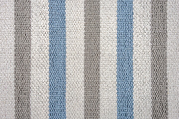 abstract background of striped carpet texture close up
