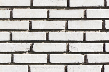 White brick wall background. Outdoor house facade texture. Gray  vintage block structure. Old architecture background.
