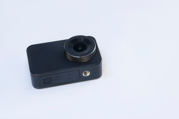Compact action camera for shooting videos and photos on a white background.