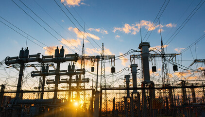 Fototapeta na wymiar power line pylons during sunset with beautiful saturated sky. distribution transmission and consumption of electricity