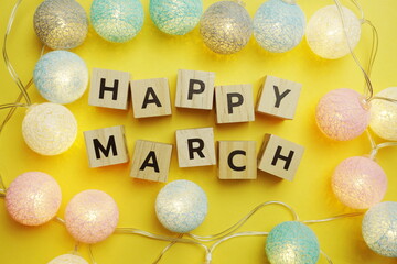 Happy March alphabet letter with LED Cotton ball Decoration on yellow background
