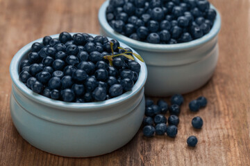 Organic bueberries on wooden board background. Healthy eating