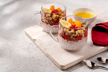 Fototapeta na wymiar Chia pudding with with raspberries and banana. Healthy nutrition, superfood. Healthy breakfast.