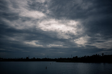 Fototapeta na wymiar Clouds over a lake