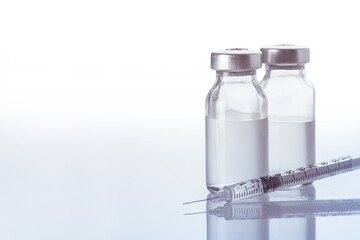 syringe and medicine bottle
