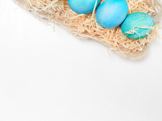 Easter eggs in a carton box on a white background.