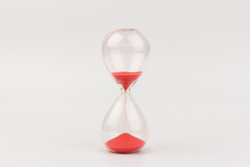 Crystal hourglass on light background as a concept of passing time for business term, urgency and...