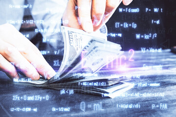 Multi exposure of Formulas drawing hologram and USA dollars bills and man hands. Education