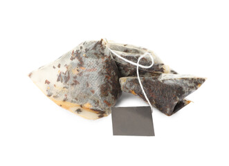 Used pyramid tea bags on white background
