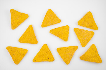 Nachos on a white background. Mexican snack, corn tortilla chips.