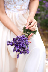 a bouquet of fresh lavender in the hands of a girl