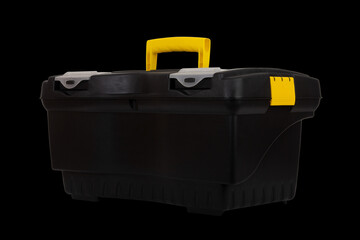 black plastic container tool box isolated on black background closeup