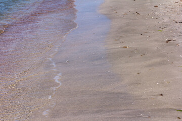 The background of sand with water splash into summer with space for text.