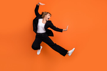 Full size profile side photo of happy excited good mood positive woman fighting karate isolated on...