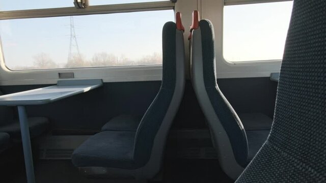 Empty seats on UK National rail train sunny day