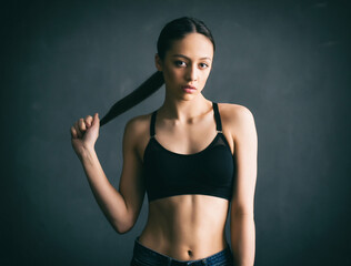 Obraz premium Beautiful young woman with a sports slim figure. Beauty portrait of attractive model