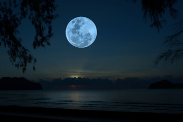 Full moon on the sky over sea.