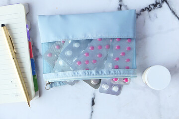 Fototapeta na wymiar pills of blister pack in a small bag on white background 