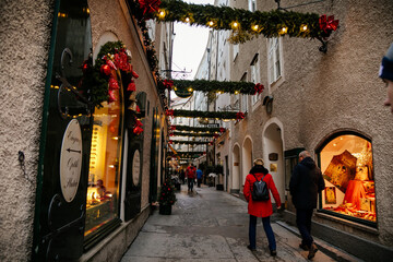 Handcrafted colorful holiday decoration at Goldgasse or Golden Street, old town, traditional...