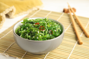 Japanese seaweed salad served on table, closeup
