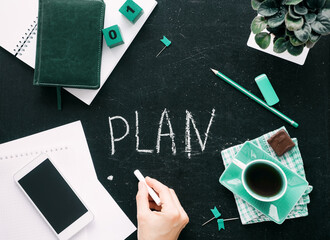Planning for the future. Top view on the desktop graphite stock. On the table is a notebook with a...