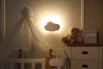 Cloud shaped night lamp in baby's room - Powered by Adobe