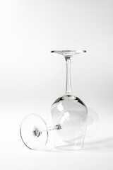 Empty wine glass on white gray background.