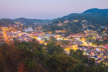 Cityscape view from Bahirawakanda at night of Kandy city lights, Kandy Lake and hill country in Sri Lanka.