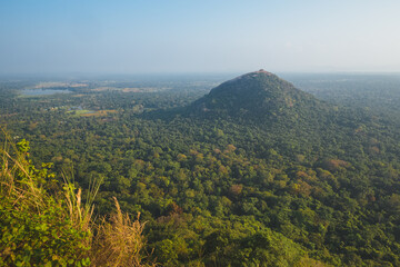 Landscape view of Pidurangala Hill  and surrounding jungle from atop Sigiriya Rock Fortress in Sri Lanka.