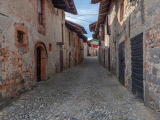 Narrow cobbled alleys of the fortified medieval village.Ricetto di Candelo, Piedmont, Italy.