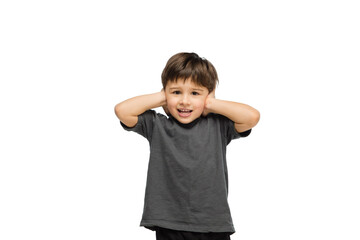 Closing ears. Happy, smiley little caucasian boy isolated on white studio background with copyspace for ad. Looks happy, cheerful. Childhood, education, human emotions, facial expression concept.