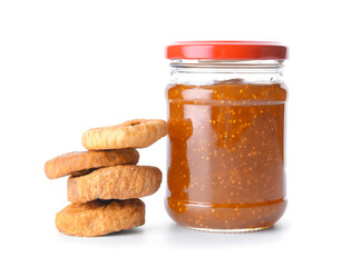 Glass jar with sweet fig jam on white background