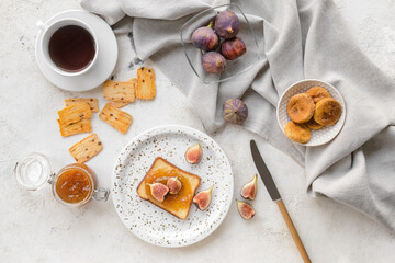 Composition with sweet fig jam on grunge background