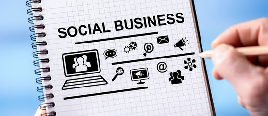 Naklejka na ściany i meble Social business concept on a notepad