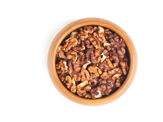 Obraz premium Shelled walnuts in wooden bowl on white