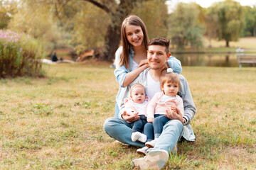 Fototapeta premium Portrait of a young beautiful family spending time together.