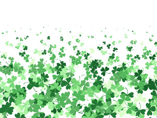 Background with clover leaves of different shades of green. A pattern for St. Patrick's Day. Vector graphics