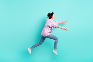 Fototapeta na wymiar Full length photo of cute pretty woman running jumping looking empty space open arms isolated turquoise color background