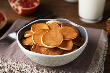 Delicious mini pancakes cereal served on table