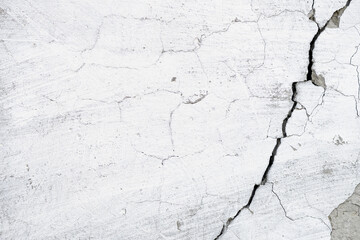 Old cracked cement wall as background, damaged facade surface as copy space